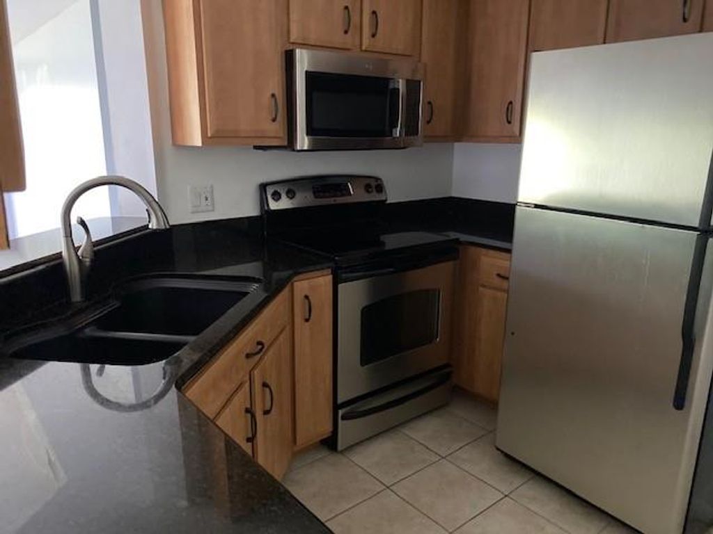 Photo of 815 W BOYNTON BEACH BLVD Blvd #9-101, Boynton Beach, FL 33426 (MLS # F10347967)