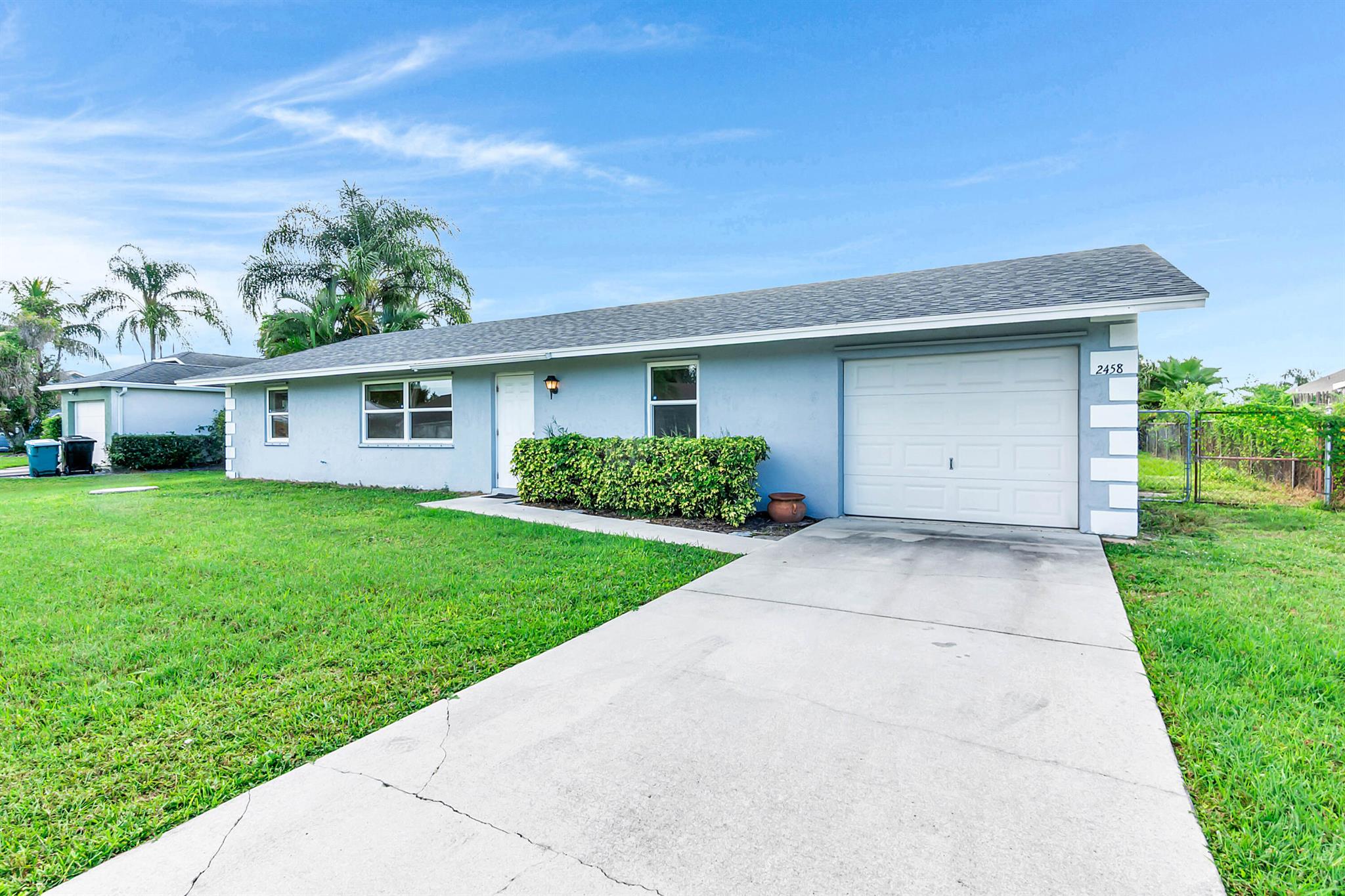 Don't miss this solid 3 bed, 2 bath gem in the heart of Port St. Lucie! With over 1,500 sq ft of tiled living space, this home is priced to sell. Roof & A/C both replaced in 2023 for peace of mind. Enjoy a screened patio that opens to a fenced backyard--perfect for pets, play, or relaxing. Large driveway + 1-car garage gives you plenty of parking. No HOA, just freedom. Only 4 mins to the Turnpike, 10 to I-95. Whether you're starting out or investing smart--this one's a win.