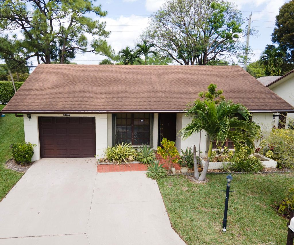 Photo of 6149 Olivewood Circle, Greenacres, FL 33463 (MLS # B26021202)
