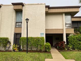Must See! 2/2 first floor condo in 55+ Woodhaven Community. This property is being offered furnished and features carpet in bedrooms with tile throughout the other rooms, custom shower in guest bathroom, walk in closets, eat in kitchen, accordion shutters, enclosed patio area and near a pool. Close to shopping and restaurants!