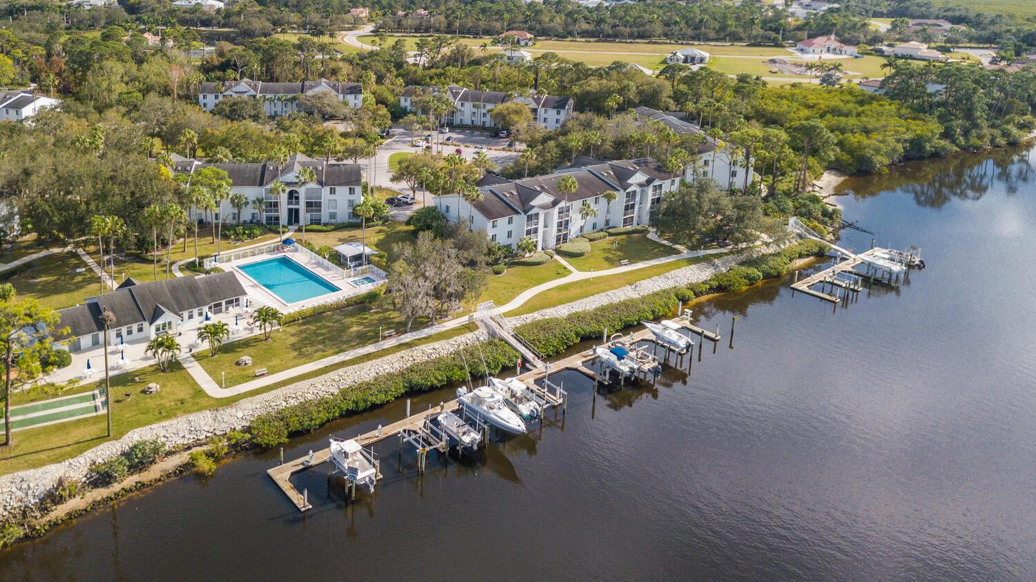 Perfect Location!!! Welcome To The Anchorage On The St Lucie! FIRST FLOOR CORNER UNIT Features 2 Bedrooms, 2 Full Baths, 2022 IMPACT GLASS WINDOWS, 2022 A/C. Family Fiendly/Pet Friendly/TRUCK Friendly. Boat Docks May Be Available To Purchase/Lease. Heated Waterfront Pool & Community Clubhouse, Tennis/Pickleball, Shuffleboard. Adjacent To The Port District's St Lucie Botanical Gardens, Pioneer Park(Splash Pad/Childrens Playground), Riverwalk, Canoe/Kayak Launch, River Nights Music. Easy Access To Shopping, Restaurants, Boating, Beaches, Parks, Public Transit, Fla. Turnpike & I-95, Tradition, Downtown Jensen Beach, Hutchinson Island Beaches. Discover Paradise On The Treasure Coast With Top-Notch Water Sports, World Class Golf, & The Best In Boating & Fishing!