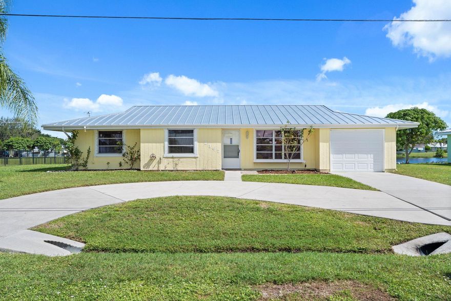 This charming 3-bedroom, 2-bathroom home offers comfort, style, and peace of mind with a brand-new roof. Enjoy beautiful lake views from the spacious living area and backyard, creating a serene setting for everyday living. The open-concept layout features plenty of natural light, a well-appointed kitchen with ample cabinetry, and a seamless flow between the living and dining spaces. The primary suite includes an en-suite bathroom and generous closet space. Step outside to a large backyard overlooking the water -- perfect for relaxing, entertaining, or adding a future pool. Ideally located near shopping, dining, parks, and beaches, this home combines value, location, and tranquil lakefront living.