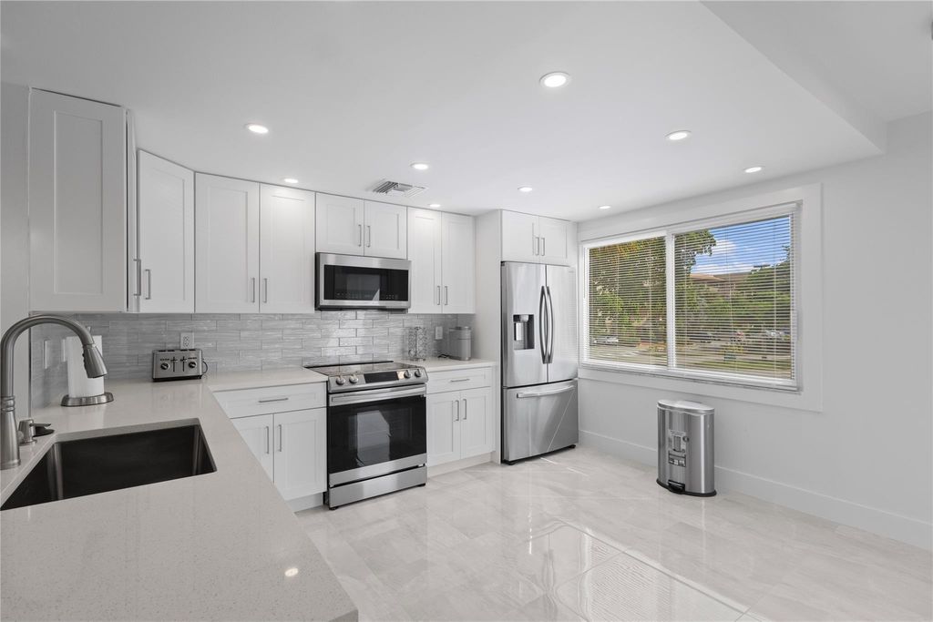 Photo of 4301 Martinique Cir #M2, Coconut Creek, FL 33066 (MLS # F10530321)