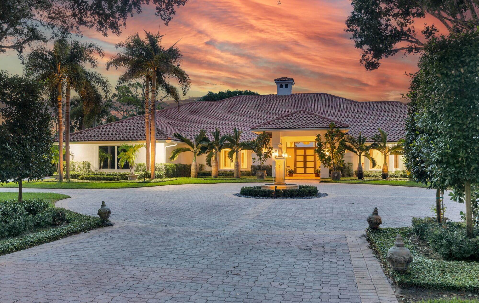 Experience privacy and serenity in this stunning Turn-Key estate home in Breakers West. Unparalleled 3/4 acre pie-shaped lot with sweeping views of clubhouse, water and 9th hole of the Rees-Jones golf course. One of a kind curb appeal for Breakers West with oversized circular car port and entry fountain. Complete with hurricane impact glass, salt water pool, Miele & Viking appliances. 2 car garage + golf cart with new epoxy flooring, custom cabinets, and impact-rated doors. Recent upgrades include: 3 zone HVAC (2020, 2021 & 2025), new AC duct system 2022, water heater 2022. Water filtration system, washer & dryer, recessed lighting, refinished pool & spa, outdoor bar, kitchen cabinets, countertops and appliances, interior & exterior paint, closet cabinets all completed in 2020-2021.