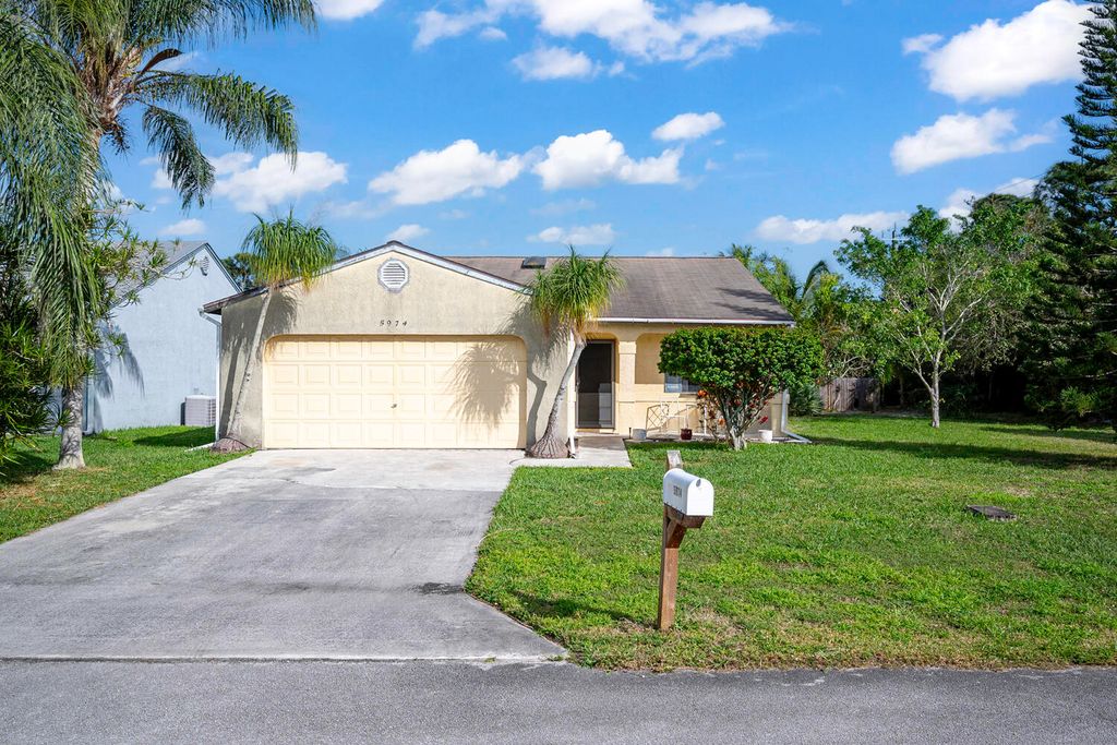 Photo of 5974 SE Pine Drive, Stuart, FL 34997 (MLS # R10959236)