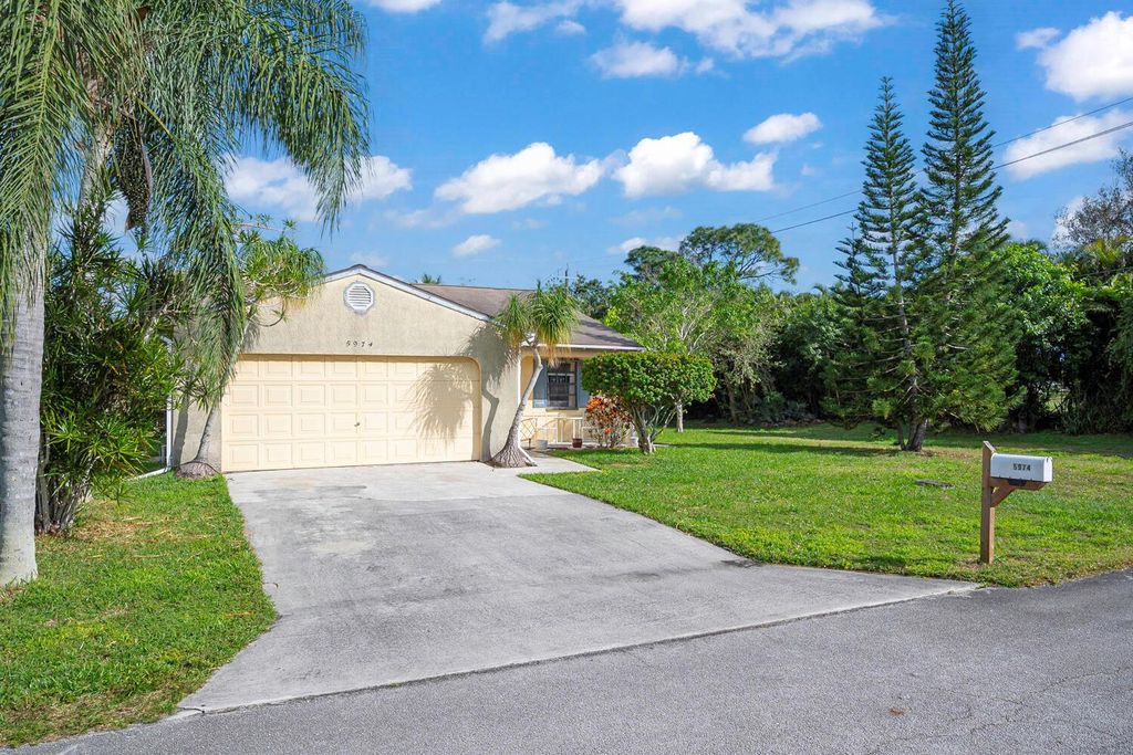 Photo of 5974 SE Pine Drive, Stuart, FL 34997 (MLS # R10959236)