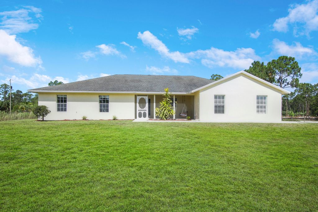 Photo of 18024 Murcott Boulevard Blvd, Loxahatchee, FL 33470 (MLS # R10807552)