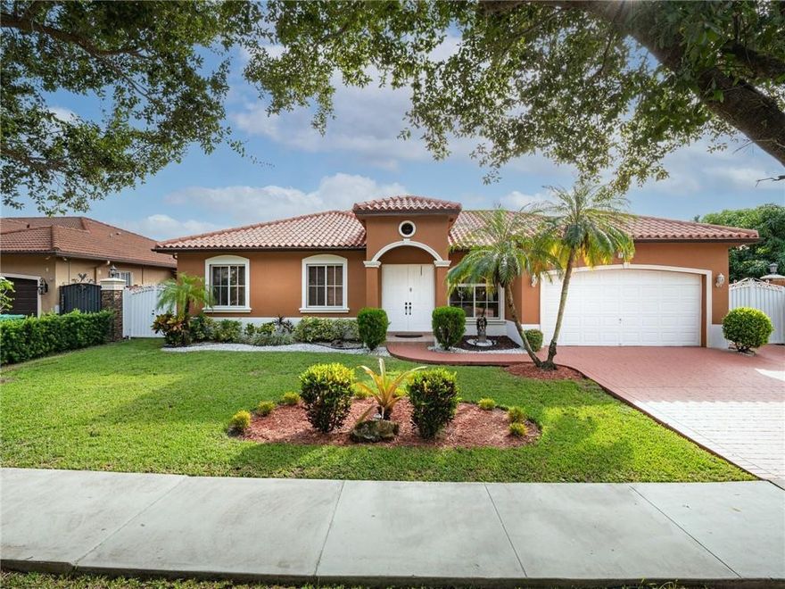 Impeccably-kept 3BD/2BA/2-CG Smart Home in Sought-after West Lakes Estates! Walking Distance from Mater Gardens Academy! Move-in Ready! Fresh paint/sealed ext/int. Roof is in mint condition. Manicured grounds inc: Oaks & assortmt of fruit trees in privately fenced backyard. From a touch on your cell-phone control: 10-camera surveillance system, auto-sprinklers, garage door, smoke-detectors & light switches. Remodeled kitchen w/espresso cabinetry, beautifully contrasted by white quartz counters, glass backsplash & S/S appl pkg.  Vaulted 12' ceiling, LED lighting & #7 flat-screen TVs w/surround-sound for in/outdoor enjoyment of music/on-screen sports. Inviting patio inc: BBQ, patio furniture, firepit & pool deck lounge chairs w/wide umbrella next to circular pool. Other upgrades! A MUST SEE! FOR SHOWINGS: PLEASE CONTACT LISTING AGENT, ELDITA GARCIA @ 305.332.3298 ONLY! Showings by appointment only. Please follow most current COVID requirements. HOA PRE-APPROVAL REQUIRED (7-10 days after receipt of application w/docs). Fees: Purchase App: $175/application. Background check: $55/per ea. person over 18