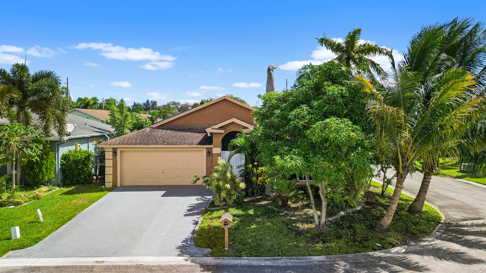 Prime Greenacres home with great bones needing some TLC! Sitting on a corner lot in a gated, low HOA community, this single story property features vaulted ceilings, an enclosed porch, and a bright layout ready for updates to make it shine. The home is ideally located near schools, shopping, dining, and major access routes, perfect for buyers who want to mold a home with potential in a sought after area.