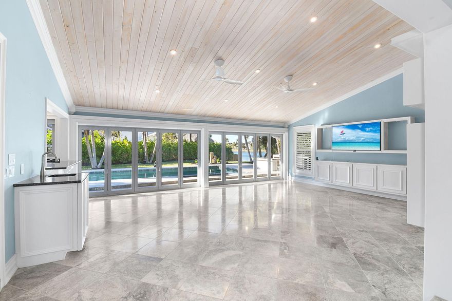 Set within the exclusive waterfront enclave of Olympus in Jupiter, this extraordinary custom residence is a rare offering for the buyer who values refined design, inspired entertaining, and effortless coastal living.
Spanning approximately 3,475 sq ft, this light-filled architectural gem offers 3 spacious bedrooms, 3.5 baths, a custom den, and a stunning library retreat, creating a home that is as intellectually inspiring as it is luxurious. Walls of glass and thoughtfully designed spaces invite natural light to pour in, enhancing the home's warm yet sophisticated ambiance.
At the heart of the residence lies an exceptional chef's kitchen designed for serious culinary enthusiasts and elegant entertaining alike. Outfitted with dual dishwashers, induction cooking steam oven, integrated warming/heating plates, and extensive custom features, this is truly a kitchen where functionality meets artistry. Whether hosting intimate dinners or large gatherings, the flow between kitchen, living spaces, and outdoor areas makes entertaining seamless. The waterfront setting provides a tranquil backdrop, while the private pool and outdoor living areas create a resort-like environment ideal for both relaxation and social gatherings. Every space has been designed to celebrate the indoor-outdoor lifestyle that defines luxury living in Jupiter.
Olympus is one of Jupiter's most coveted hidden enclaves, a boutique waterfront community known for its privacy, tennis amenities, and remarkably low HOA. Located just minutes from pristine beaches (accessible through a PRIVATE beach access path), world-class golf, marinas, and the area's finest dining and shopping, residents enjoy both exclusivity and convenience. This is a residence for the discerning buyer who seeks more than just a home - it offers a lifestyle of quiet luxury, waterfront beauty, and inspired living in the heart of Jupiter.  Listed BELOW appraised value.