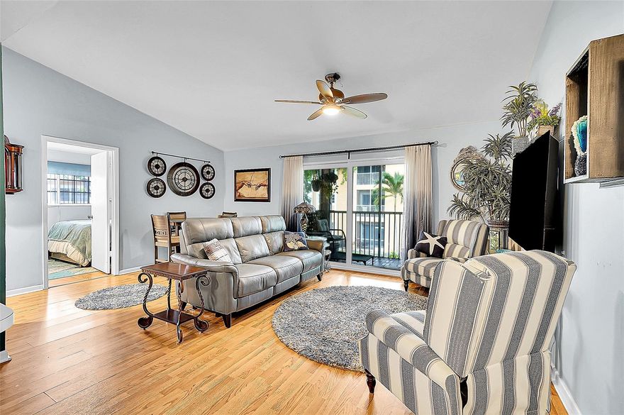 Beach vibes just 1.5 miles away! This sunny 2/2 condo gives you pool views from the bedrooms, morning coffee on your screened balcony, and peace of mind with an impact slider. Love color? The cheerful kitchen and open layout shine with personality. Washer/dryer in unit, Roman tub for bubble baths, and bonus storage closet. Community perks include a pool and clubhouse. Pet-friendly and east of US1! Two assigned parking spaces included along with plenty of guest parking. No rentals 1st year. Easy breezy Dania Beach living starts here!