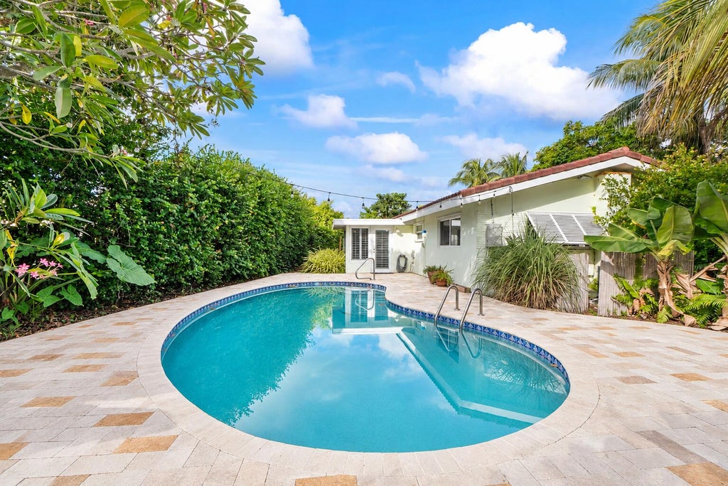 Photo of 410 NE 36th Street, Boca Raton, FL 33431 (MLS # B26092055)