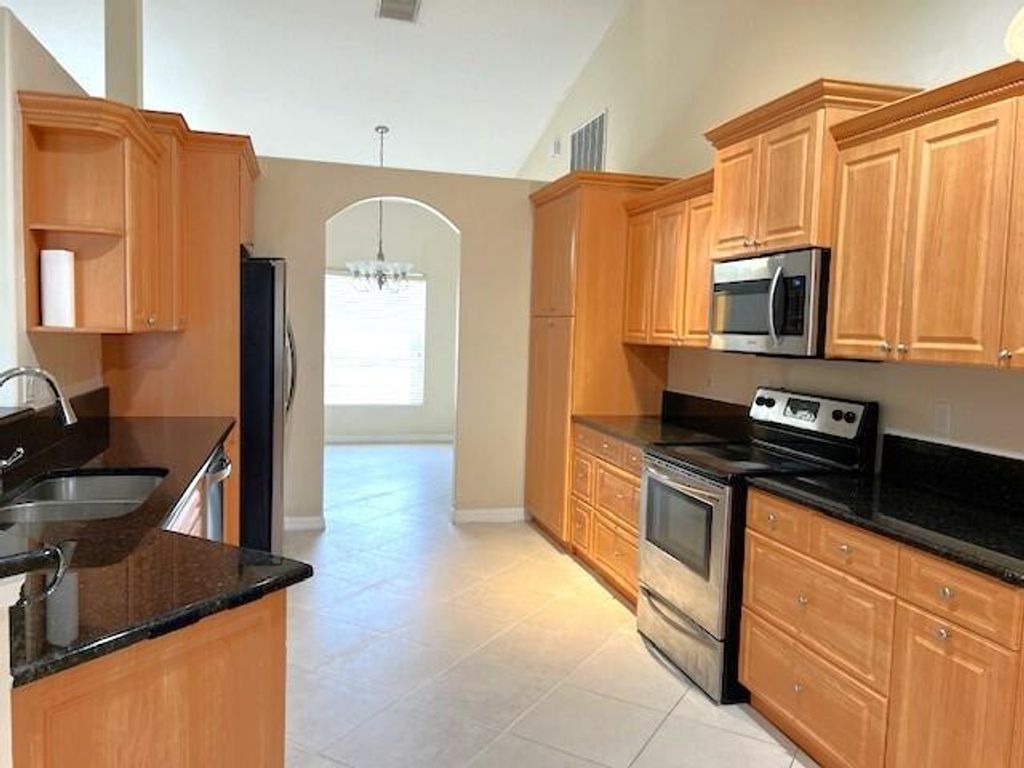 Photo of 4226 SW Whitebread Road, Port Saint Lucie, FL 34953 (MLS # R10975066)
