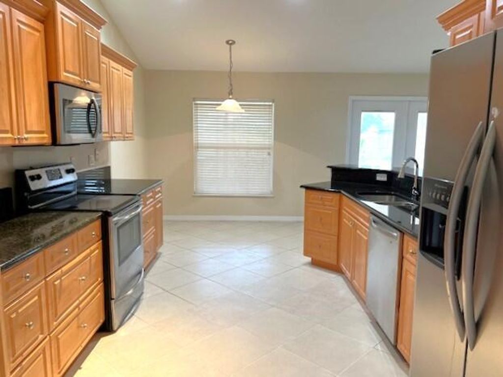 Photo of 4226 SW Whitebread Road, Port Saint Lucie, FL 34953 (MLS # R10975066)