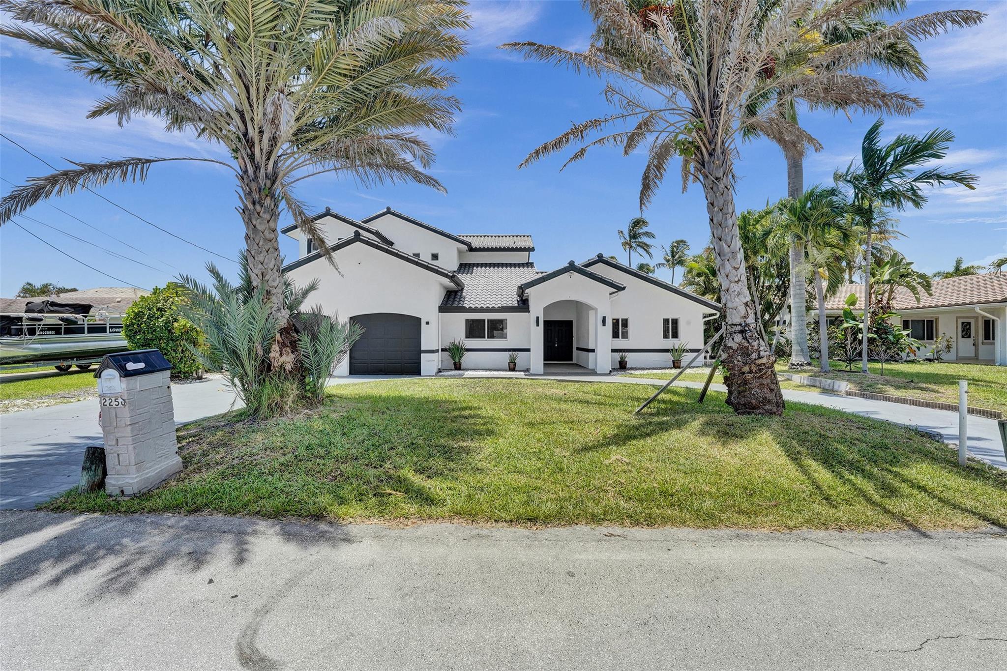 Beautifully renovated and move-in ready! This 6-bedroom, 4-bath two-story home offers the ultimate coastal lifestyle in east Pompano Beach. Bring your boat! Private dock with deepwater, Ocean Access & No Fixed Bridges! Enjoy a modern kitchen with high-end stainless steel appliances, granite countertops & Island! Completely remodeled home with large bedrooms & closets, updated bathrooms, new tile & luxury vinyl flooring, & open layout perfect for entertaining. Plus, a two car garage! Relax by your own private pool, take in serene canal views, and enjoy the comfort of a large patio, covered lanai, grill & fire pit. Located in a quiet waterfront community minutes from Inlet & Ocean Access, Pompano & Lauderdale by the Sea beaches. Can be Furnished or Unfurnished! Call for Seasonal Pricing!