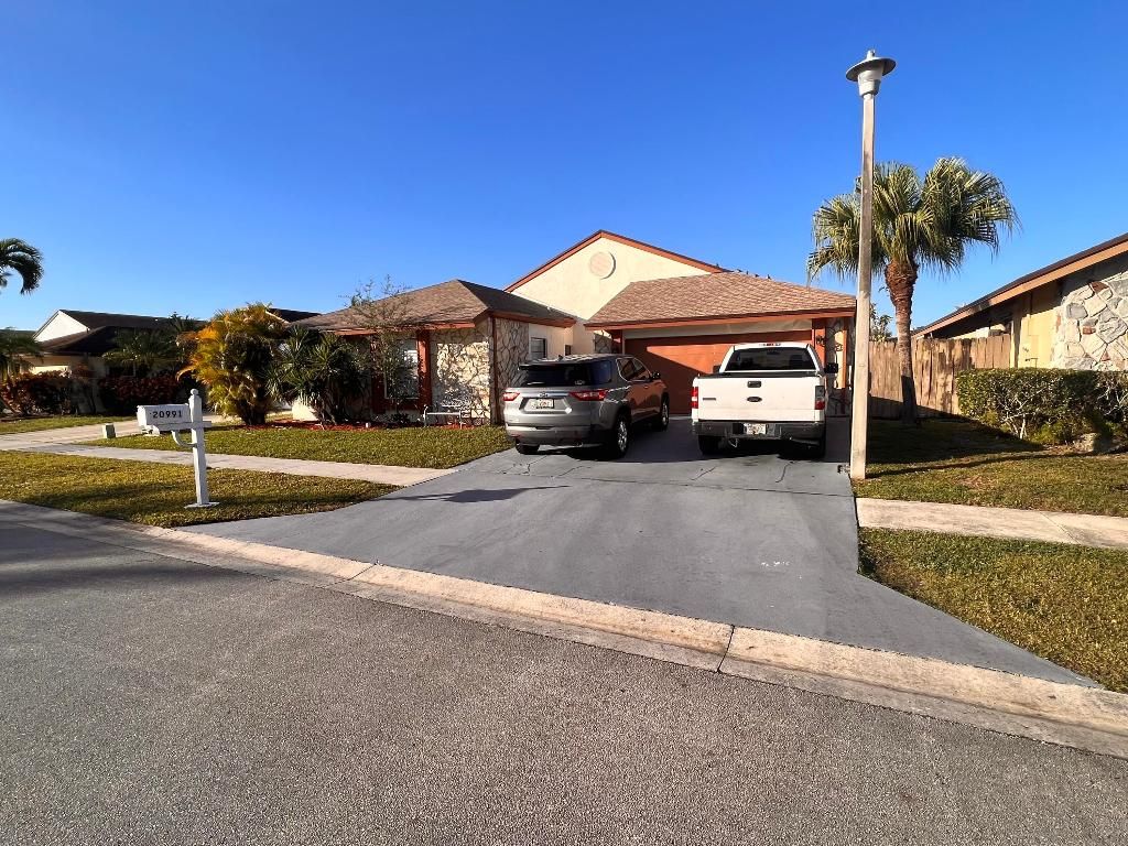 Photo of 20991 Woodspring Avenue, Boca Raton, FL 33428 (MLS # R11059547)