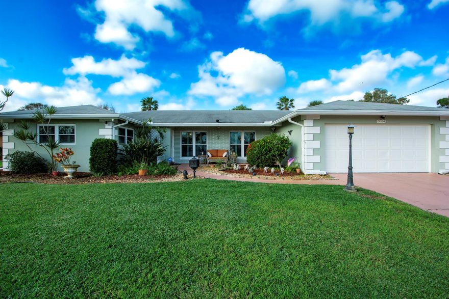 Welcome to your dream home in Port St Lucie with a *brand new roof* in process! This stunning 2-bedroom, 2-bathroom home offers a spacious 1805 sq ft of living space, all overlooking a picturesque golf course. As you step inside, you'll be greeted by the elegance of terrazzo floors and a completely remodeled interior, featuring a bright and open airy floor plan.
The kitchen is a chef's delight, featuring granite countertops, a pass-through window to the pool area, a double sink, and a range vented to the outside. With a double oven and extra counter space, cooking for family and friends is a breeze. The separate dining room boasts a custom mirror, adding to the home's unique charm.

The oversized master bedroom includes a walk-in closet and The oversized master bedroom with ensuite bath has a step-in shower, as well as sliding doors leading to the patio. The laundry room offers extra cabinets and closets for convenient storage.
Throughout the home, plantation shutters adorn the windows, adding a touch of sophistication and privacy. Step outside to the screened lanai and discover your own private oasis, beautiful pool and heated spa, perfect for relaxing or entertaining guests while enjoying the stunning golf course sunset view.
Renovated in 2014, other features include new gutters, new pool and spa heater, pool was resurfaced in 2017 and the attic has been reinsulated. Located in the sought-after quiet neighborhood of Sandpiper Bay, you'll enjoy easy access to beaches, shopping, downtown Jensen Beach for restaurants, and the mall. The nearby public golf course is within walking or riding distance, making it a perfect location for golf enthusiasts.
All patio furniture is included, making this home move-in ready for you to start enjoying the Florida lifestyle. Don't miss this opportunity to own a piece of paradise in Port St Lucie!
