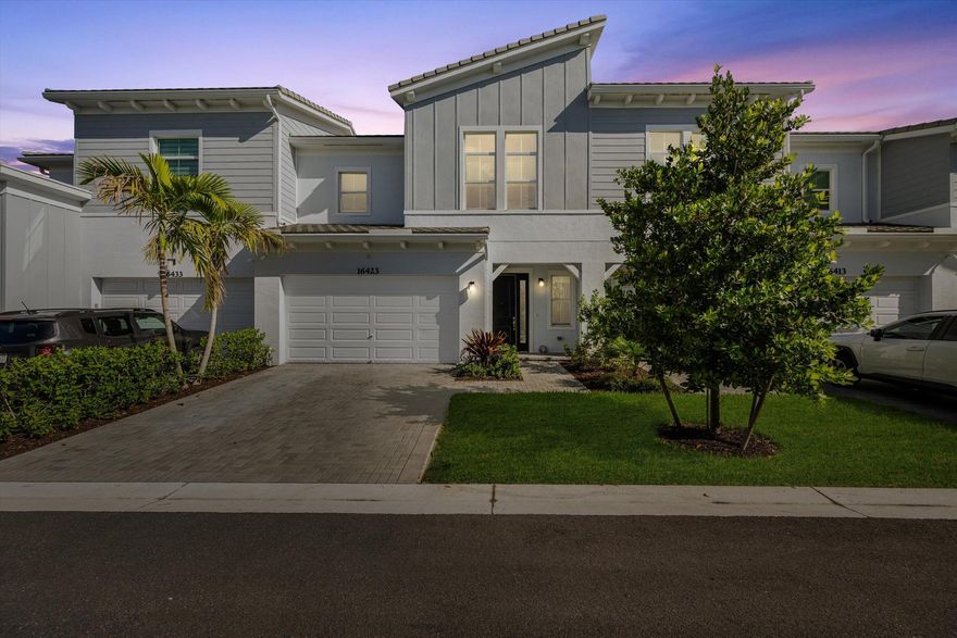Welcome to the highly sought-after Biscayne model in The Crossings community in Westlake, FL! This spacious three-bedroom, two-and-a-half bathroom, two-story townhouse offers modern style and an inviting open layout. Step through the striking black front door into a bright first floor with tile flooring throughout and an expansive living room, a separate dining area, and abundant natural light. The chef's kitchen showcases rich brown shaker cabinets, granite countertops, stainless steel Whirlpool appliances, and a large island with ample storage--perfect for entertaining or family gatherings. A convenient powder bath is also located downstairs.