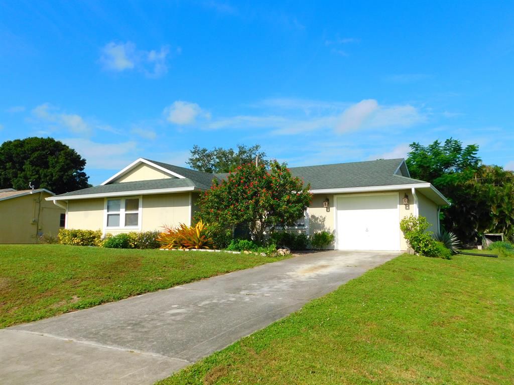 Photo of 454 SE Cork Road, Port Saint Lucie, FL 34984 (MLS # R10752687)