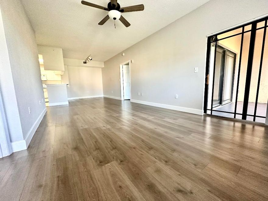 PRIME LOCATION, in the heart of PBG located directly behind Gardens Mall with a quick access to 95 and numerous restaurants. Spacious  2 bedroom/2 bath penthouse with open kitchen/living room concept along with sliders leading out to a screened in patio. Unit has been  freshly painted, with new floors & new dryer. Enjoy the amenities of San Matera, a privately gated community with a large pool, hot tub, fitness room, sauna, steam room and coming soon pickle ball courts. Resort style living at its best.