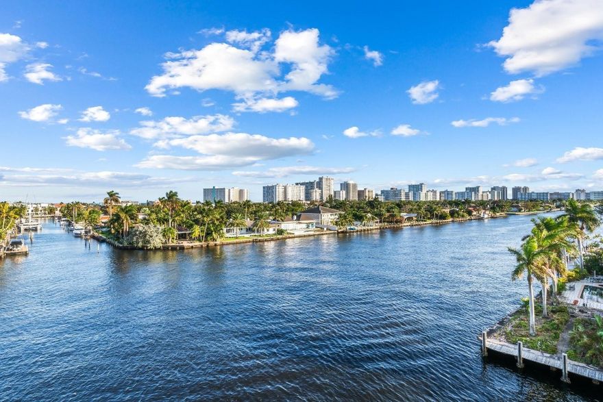 Direct waterfront views through floor-to-ceiling impact glass. Remodeled featuring porcelain floors, European style cabinetry & Architectural Series black SS appliances, oversized frameless glass shower enclosure and double vanities. Full-size front-loading washer/dryer, SS sink & custom cabinetry for maximum storage. Large storage room (a/c). Secured covered parking. Wood-burning fireplace w/ stacked stone.