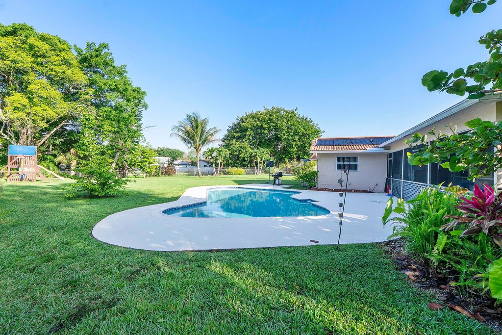 Photo of 4020 NW 113th Avenue, Coral Springs, FL 33065 (MLS # B26025012)