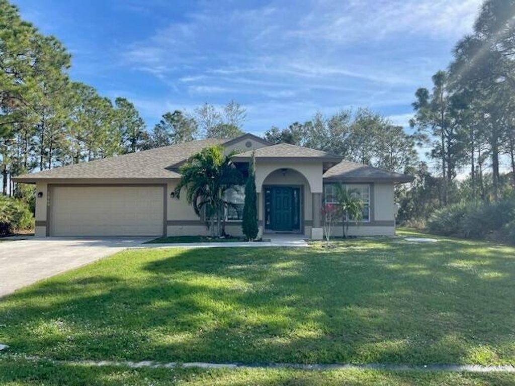 Photo of 5869 NW Carovel Avenue, Port Saint Lucie, FL 34986 (MLS # R11057464)
