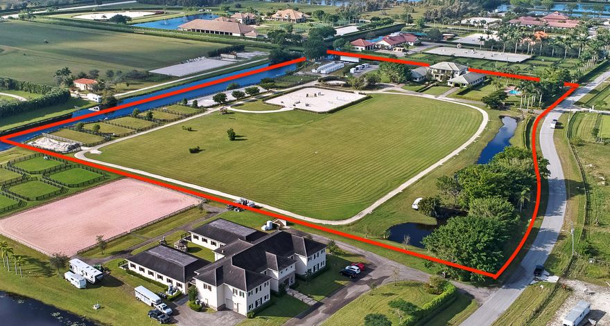 Just renovated, income producing property can easily accommodate 64 horses.  One of Palm Beach Point's premiere equestrian facilities situated on 16 acres of pristine land and equipped for all of your horse's needs. Property includes 24 spacious and immaculate permanent stalls, 1/3 mile all-weather track, NEW 140'x 250' jumping arena with all-weather footing by Equitan, Olympic sized dressage ring, manicured grass grand prix field, 2 treadmill hookups, 2 rv hookups, a 40 stall tent pad equipped with electric/flyspray/water & equine spa hookup. Includes 4 bedroom, 2 bathroom owners' apartment that boasts high ceilings, marble accents, wood floors and a beautiful open balcony. The grooms' apartment offers 2 bedrooms, 2 bathrooms, and a shared kitchen. Listing includes 14630 & 14710 & 14670 Palm Beach Point Boulevard.
Also Available on 10 Acres.  Please also refer to 10.62 acre listing RX-10388566.