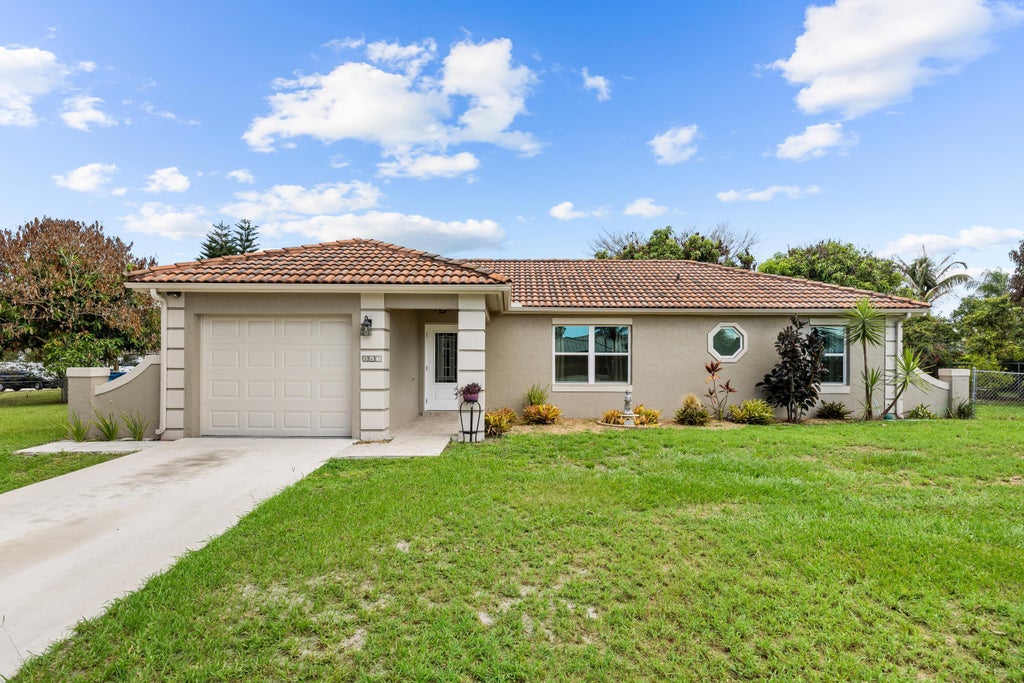 Photo of 265 SW DALTON Circle, Port Saint Lucie, FL 34953 (MLS # B26069404)
