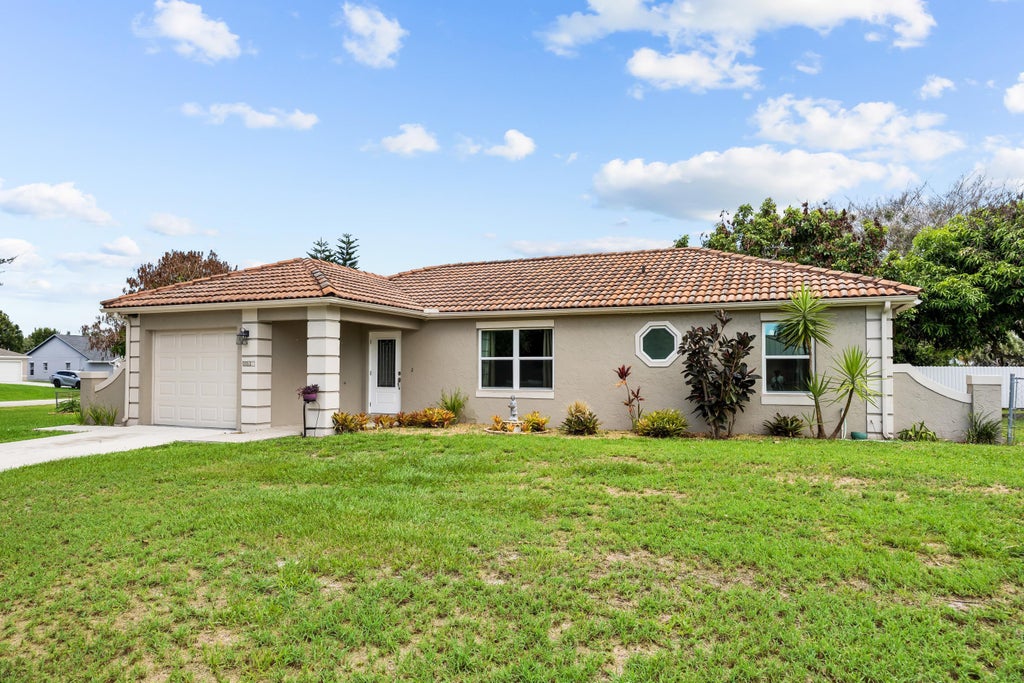 Photo of 265 SW DALTON Circle, Port Saint Lucie, FL 34953 (MLS # B26069404)