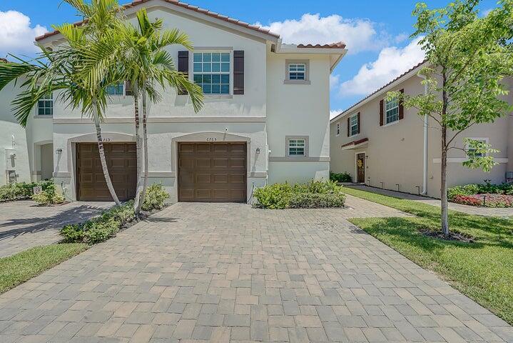 Stunning 4BR/2.5BA end unit townhome in a desirable gated community! Recently built, this modern home features an open-concept layout with a spacious kitchen, dining, and living area. All bedrooms are upstairs, including a generous primary suite with walk-in closet. Includes impact windows/doors, stylish fixtures, private patio with large green space, and outdoor storage. Community offers a pool, playground, and low HOA. Prime location near shops, dining, and major highways. Motivated Sellers! Don't miss this rare opportunity!