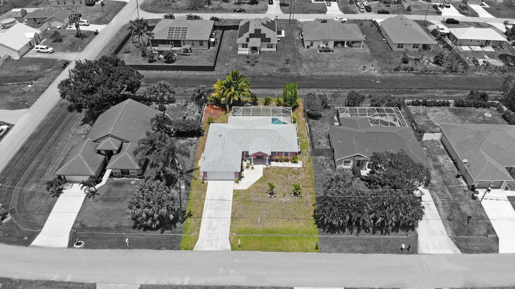 Photo of 771 SW Estate Avenue, Port Saint Lucie, FL 34953 (MLS # R11089030)