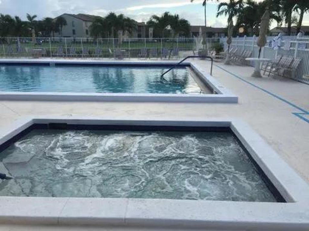 Photo of 819 Sky Pine Way #A1, Greenacres, FL 33415 (MLS # R11140936)