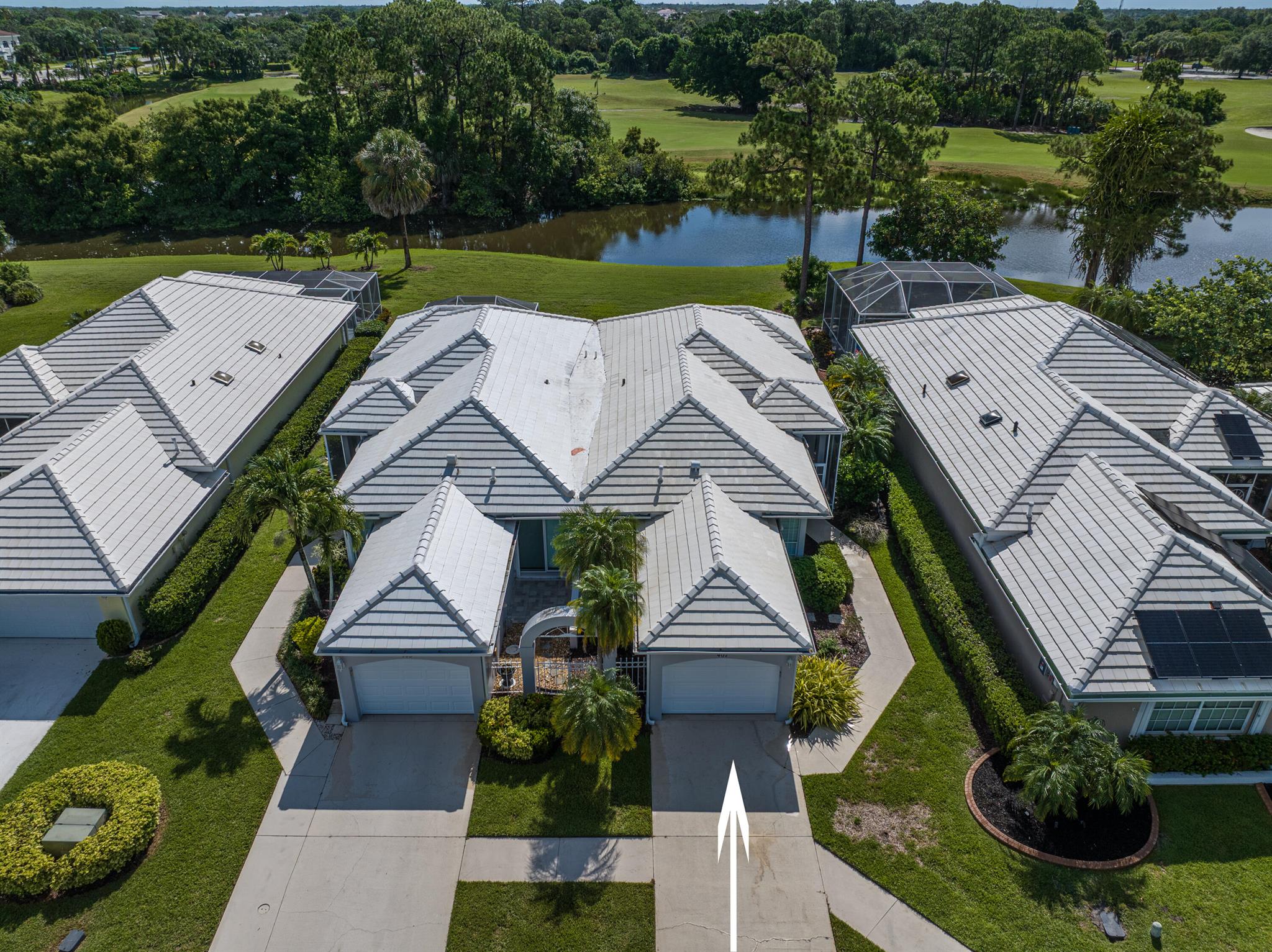 LIGHT & BRIGHT 2BR/2BA/1CG VILLA! Located in Fairway Isles on a quiet cul-de-sac, this home has been well maintained and has recent updates including NEW ROOF IN 2017, NEW WATER HEATER 2025, NEW WASHER & DRYER 2025. The 'Tuxedo' style kitchen features wood cabinetry, solid surface counters, SS appliances, subway tile backsplash, stylish cabinet hardware and a cozy breakfast nook. The split floor plan allows for privacy between the bedrooms. Other features include an abundance of windows which fill this unit with natural light, screened front entry and frame-less glass shower in master bath. Enjoy the peaceful sunrises & relax while taking in the view from the screened & covered lanai over looking the 1st hole of the St Lucie Trail Golf Club. HOA dues inc. exterior painting, roof cleaning,