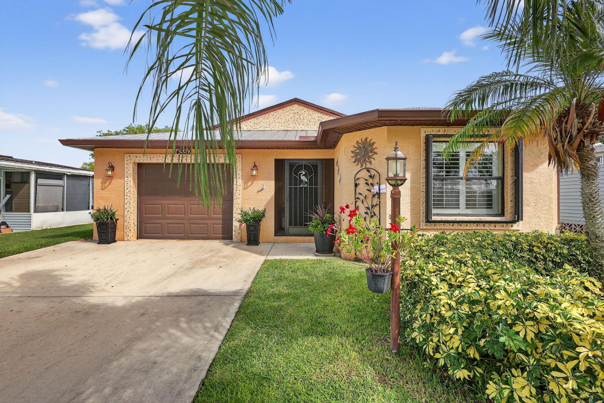 Welcome to this beautifully maintained 3-bedroom, 2-bath home located in the 55+ community of Spanish Lakes Fairways. Enjoy tranquil lake views and a relaxed Florida lifestyle in this bright and open residence. The home has laminate wood flooring throughout--no carpet here--offering a clean, modern feel. The spacious great room flows seamlessly into the open kitchen, which features elegant granite countertops and ample cabinet space. The primary suite includes a generous walk-in closet and a double vanity. Enjoy your morning coffee or evening cocktail on the screened-in lanai, which offers a serene view of the lake. The home also features a 1-car garage, a full indoor laundry room, and well-maintained landscaping that enhances its curb appeal.