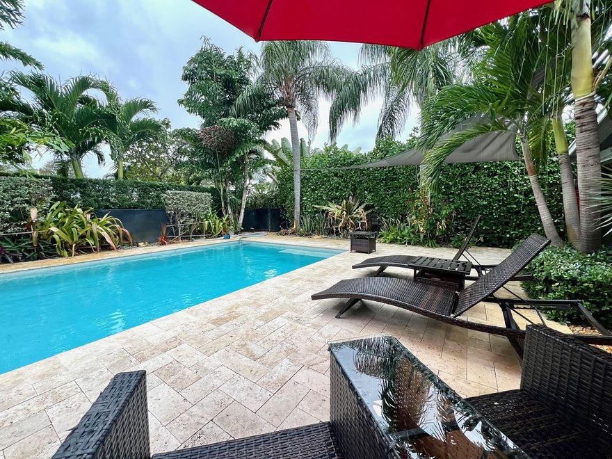 Completely updated home in Wilton Manors just a few minute stroll from Wilton Dr. Contemporary Mid Century Modern home with an open concept design.  Beautiful Travertine floors throughout. Charming Dining area overlooking grounds.  The tropical courtyard-style entry sets the tone for the home, leading to a newer saltwater pool that awaits your relaxation. Step into the lush and intimate backyard, where a private "Lounge Area" and Jacuzzi Spa create an oasis of tranquility perfect for entertaining.  The home boasts a range of modern amenities, including a newer high-efficiency A/C system to keep you comfortable year-round. All PVC plumbing (36K) The property also features a convenient 1-car carport and ample parking space for your convenience.Impact Windows & Doors. Exterior Storage Room