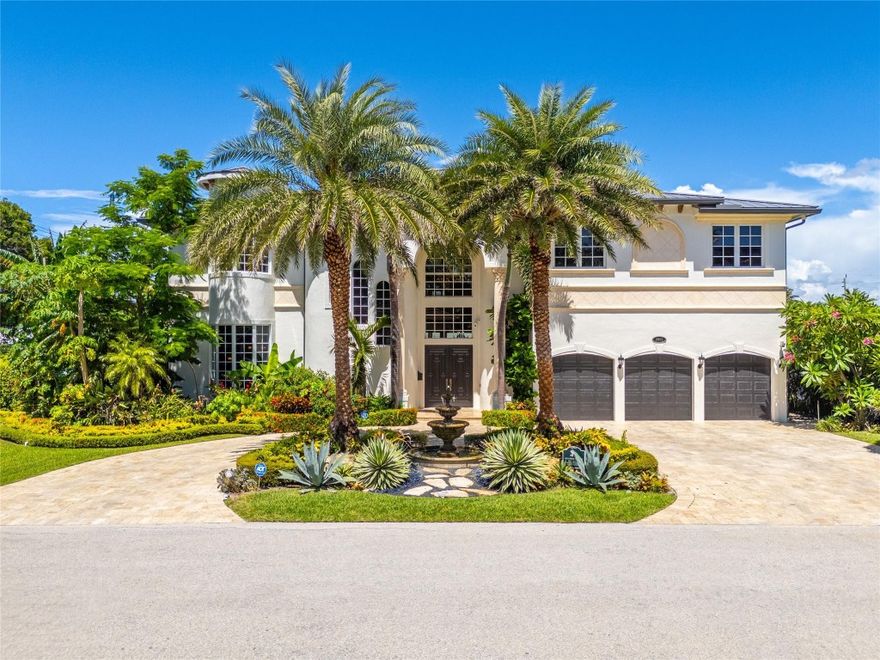 Prime location! Stunning, waterfront estate in prestigious Venetian Isles. Situated on the most sought-after street, this home boasts 100’ of deep-water frontage & an 80’ Trex dock w/ water & electric. The bright, naturally lit interior features a grand entryway & formal living room boasting high ceilings & statement fireplace. There is one bedroom w/ ensuite bath downstairs (currently used as an office); take the elevator upstairs, where you will find the primary suite, open loft & 3 more bedrooms w/ ensuite baths. Just about 15 minutes to the Hillsboro Inlet with no fixed bridges, this home features impact windows & a new metal roof.  Enjoy the lushly landscaped backyard oasis with a heated pool & spa, perfect for entertaining. Ideally located near the LHP Yacht Club, dining & more.