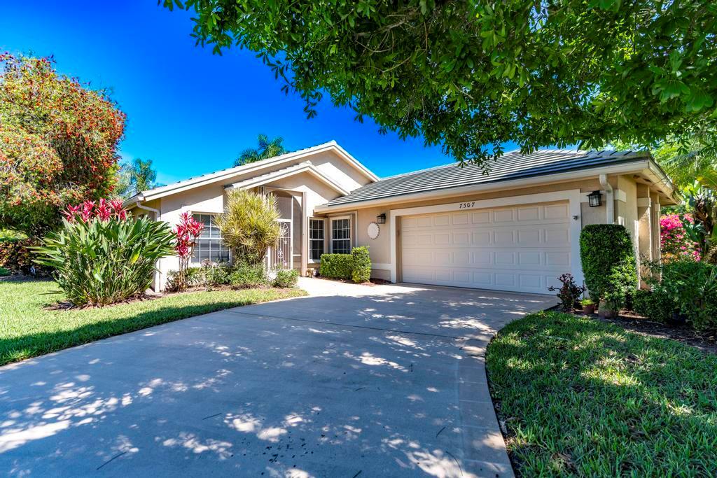 Welcome to prestigious Marsh Landings at PGA Village! This beautifully maintained 3-bedroom, 3-bathroom home features a 2-car garage and a desirable open floor plan flooded with natural light, perfect for both everyday living and entertaining. The master bathroom has been completely renovated and includes dual sinks, offering a spa-like retreat. Enjoy the Florida lifestyle with a screened pool and spacious patio, ideal for relaxation or hosting guests. The home boasts elegant ceramic tile throughout main areas and comfortable carpet flooring in all bedrooms. Residents enjoy exceptional amenities including a fully equipped gym, banquet room, pro shop with optional golf and social memberships, tennis courts, pickleball, playground, and more. New garage door rated for hurricane strength.