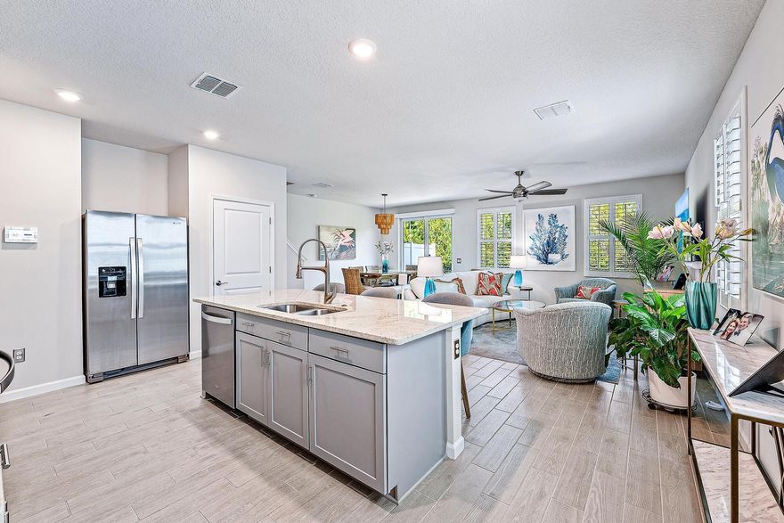 Luxury, quality upgrades in spacious smart home. Private location - no neighbors behind. Plantation shutters & automated shade create light, bright space for daily living; dimmer switches for evening ambiance. Whole-house upgrades: brushed nickel faucets & shower hardware, lever door handles/hinges, ceiling fans, towel bars/accessories, dehumidifier, soft-close cabinets. Kitchen: granite countertops, custom backsplash, upgraded dishwasher, tip-out tray at sink, chef-style pull-out faucet, spacious pantry w/solid wood ventilated shelves. Primary suite: walk-in closet w/solid wood built-ins, bath w/heavy-duty barn-style shower door & solid wood glass-front linen cabinet w/5 drawers. Huge loft: office, play area or den. Furniture available for purchase.