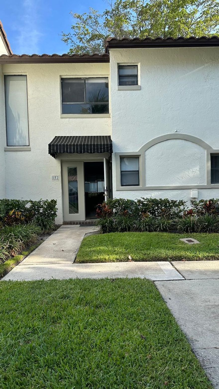 Beautifully remodeled 2-bedroom, 2-bath condominium in the desirable Sunflower Condominium community in Boca Raton. This move-in ready unit features new A/C, water heater, and roof (2024) along with laminate flooring throughout the first floor, wood laminate stairs, and updated bathrooms with elegant wood cabinetry. The modern kitchen offers quartz countertops and updated finishes.  The unit includes a full-size Samsung washer and dryer in a separate in-unit laundry closet, walk-in closets, and a private balcony with peaceful garden views. The community offers excellent amenities including a beautiful pool, clubhouse, fitness center, billiard room, jogging path, and community room perfect for social gatherings.  Maintenance covers building insurance, reserves, and basic cable.