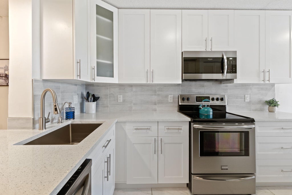 Photo of 5380 CEDAR LAKE Drive #304, Boynton Beach, FL 33437 (MLS # B26078563)