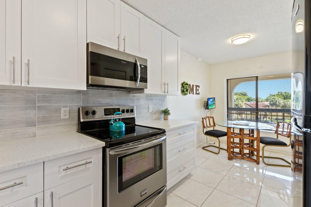 Photo of 5380 CEDAR LAKE Drive #304, Boynton Beach, FL 33437 (MLS # B26078563)
