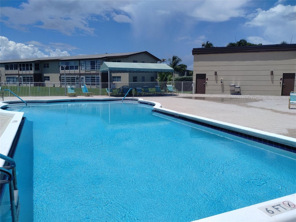 Photo of 7300 NW 5TH Court #205, Margate, FL 33063 (MLS # B26077613)