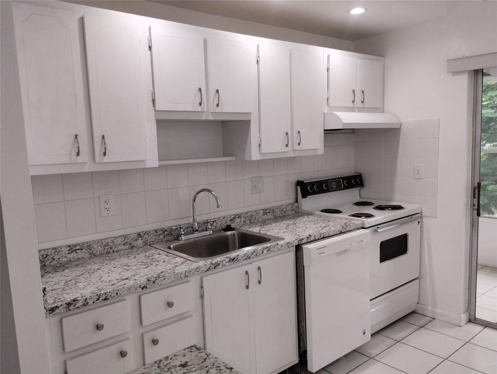 Photo of 7300 NW 5TH Court #205, Margate, FL 33063 (MLS # B26077613)