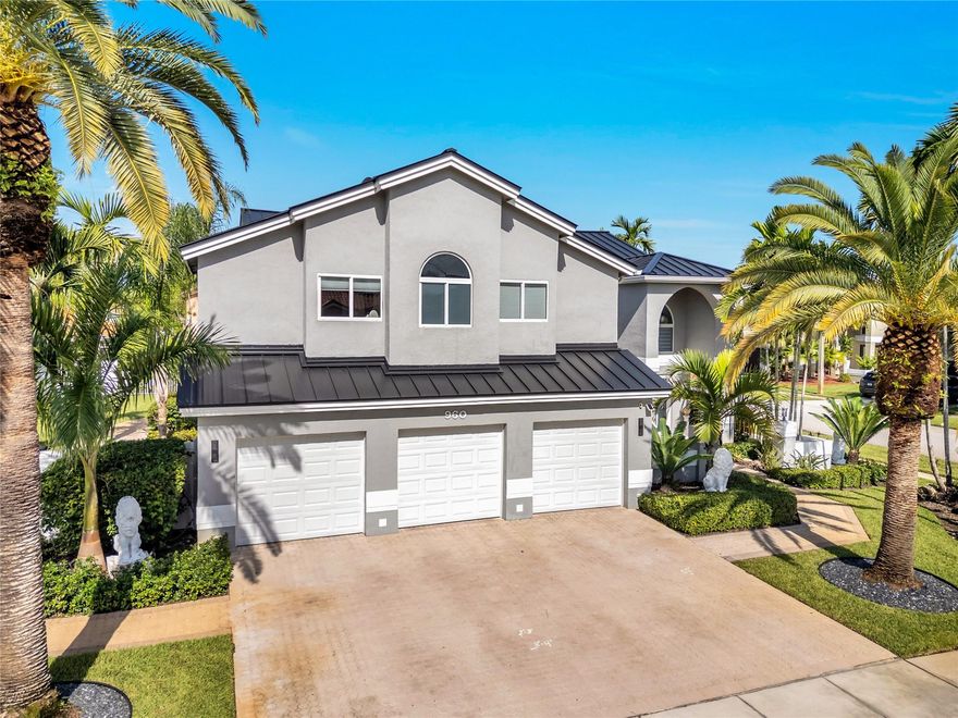 Welcome to this beautifully renovated 4-bedroom, 3-bath home where pride of ownership shines. With 3,292 sq ft of living space on an oversized corner lot, it offers a spacious layout and peace of mind with a new metal roof (transferable warranty) and full impact windows & doors. Inside: updated bathrooms, stylish kitchen, new electric panel, tankless water heater, LED recessed lighting, and smart-home controls for locks, garage, 2 ACs, lighting, and sprinklers. 48x48 porcelain floors downstairs, laminate upstairs, custom closets, and neutral finishes create a timeless look. One bedroom and full bath on the first floor, plus a primary suite with bonus room for office/nursery. Dual laundry setups and an EV-ready garage add convenience. Resort-style amenities complete this move-in ready home
