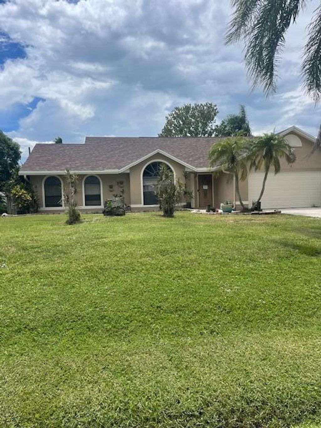 Photo of 618 SE Streamlet Avenue, Port Saint Lucie, FL 34983 (MLS # R11120259)