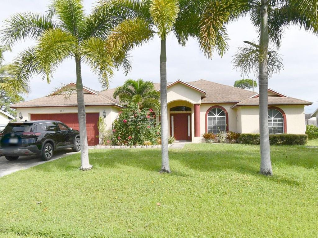 Photo of 381 SE Evans Avenue, Port Saint Lucie, FL 34984 (MLS # R10991257)