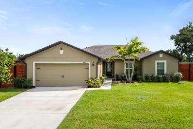 Welcome to this gem in the heart of St. Lucie North, offering 3 bedrooms and 2 bathrooms plus a den which can easily be converted to a 4th bedroom. Built in 2023, this home shines with modern upgrades throughout. Bright and open floor plan. Quiet neighborhood. Some improvements include a custom built in closet in the primary room along with new flooring in the primary room. Custom cabinets in laundry room. Fully fenced in property on a marsh with various landscaping upgrades. There is a 10 year structural builder warranty that is transferable to the new owner. 10 year warranty on the AC. Smart home thermostat and smart garage door. All appliances are 2023. Washer/Dryer not included. NO Drive Bys/Do Not disturb homeowners as home is owner occupied. Showings will start 9/26/2025