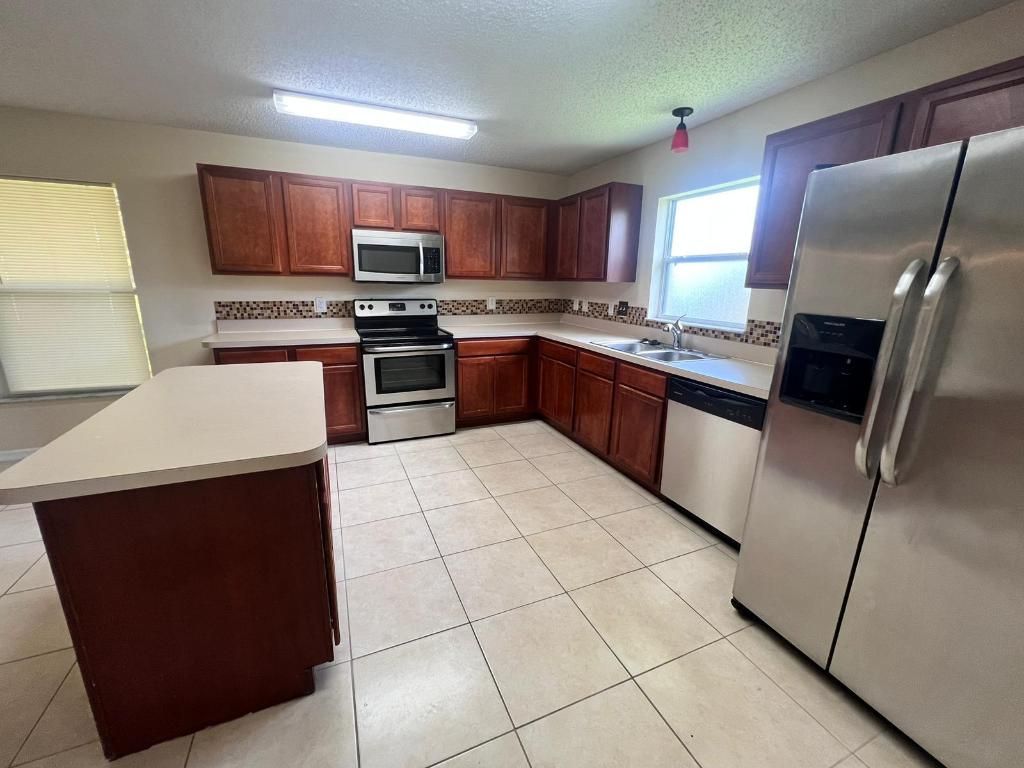 Photo of 1209 SW Idol Avenue, Port Saint Lucie, FL 34953 (MLS # R11145648)