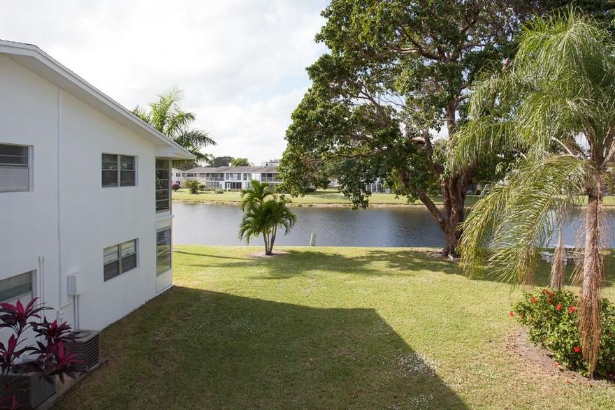 R E D U C E D ! ! C O R N E R ! 2ND FLOOR 1 BDR. 1.5 BATHROOMS ,SPECIAL UNIT WITH THE SHOWER IN THE HALF OF BATHROOM with a beautiful waterview and gorgeous palm trees and orchids from the LIVING ROOM, NEW A/C INSTALLED 06/21/2016, TILED AND FULLY FURNISHED, bedroom is floating floor, bright unit , with a nice kitchen! 3 MINUTES distance to SWIMMING POOL AND THE CLUBHOUSE,  P R I M E   L O C A T I O N !Community claims 55+